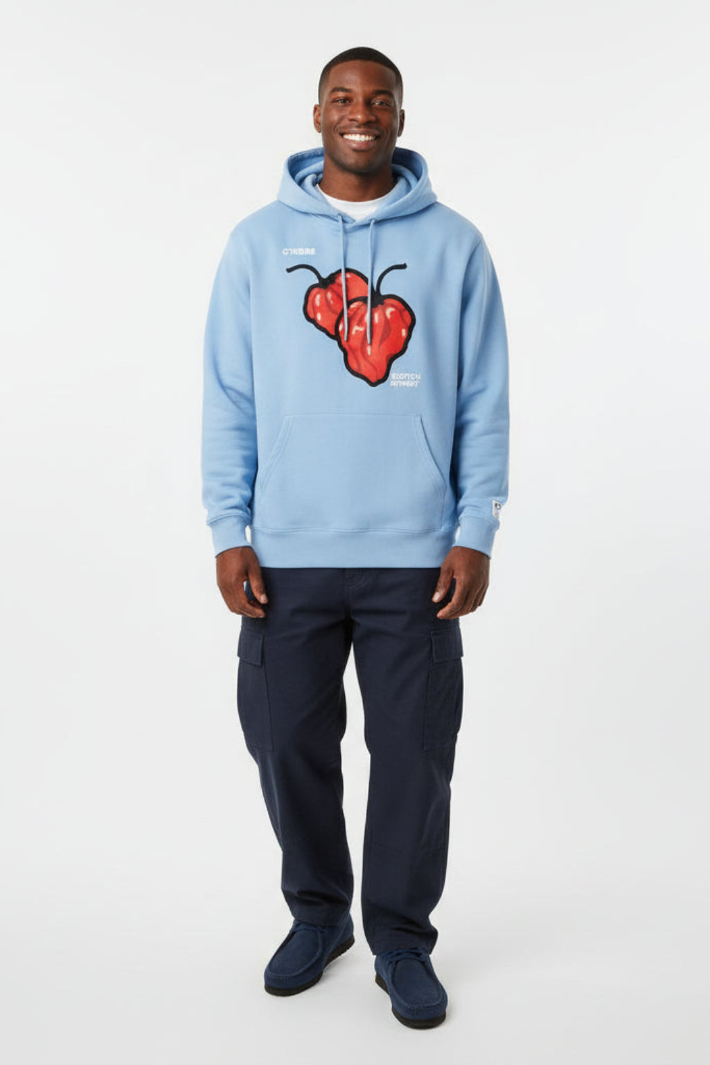 Woman wearing a Scotch Bonnet graphic hoodie in Blue Soul on a white background