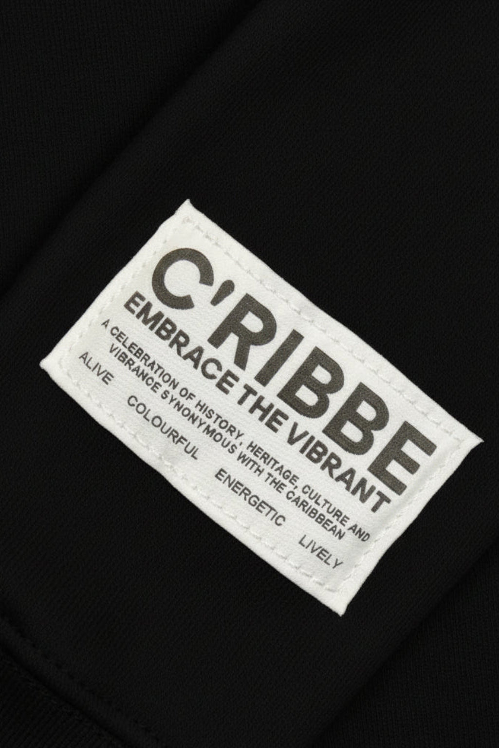 CRIBBE woven label on Black hoodie sleeve