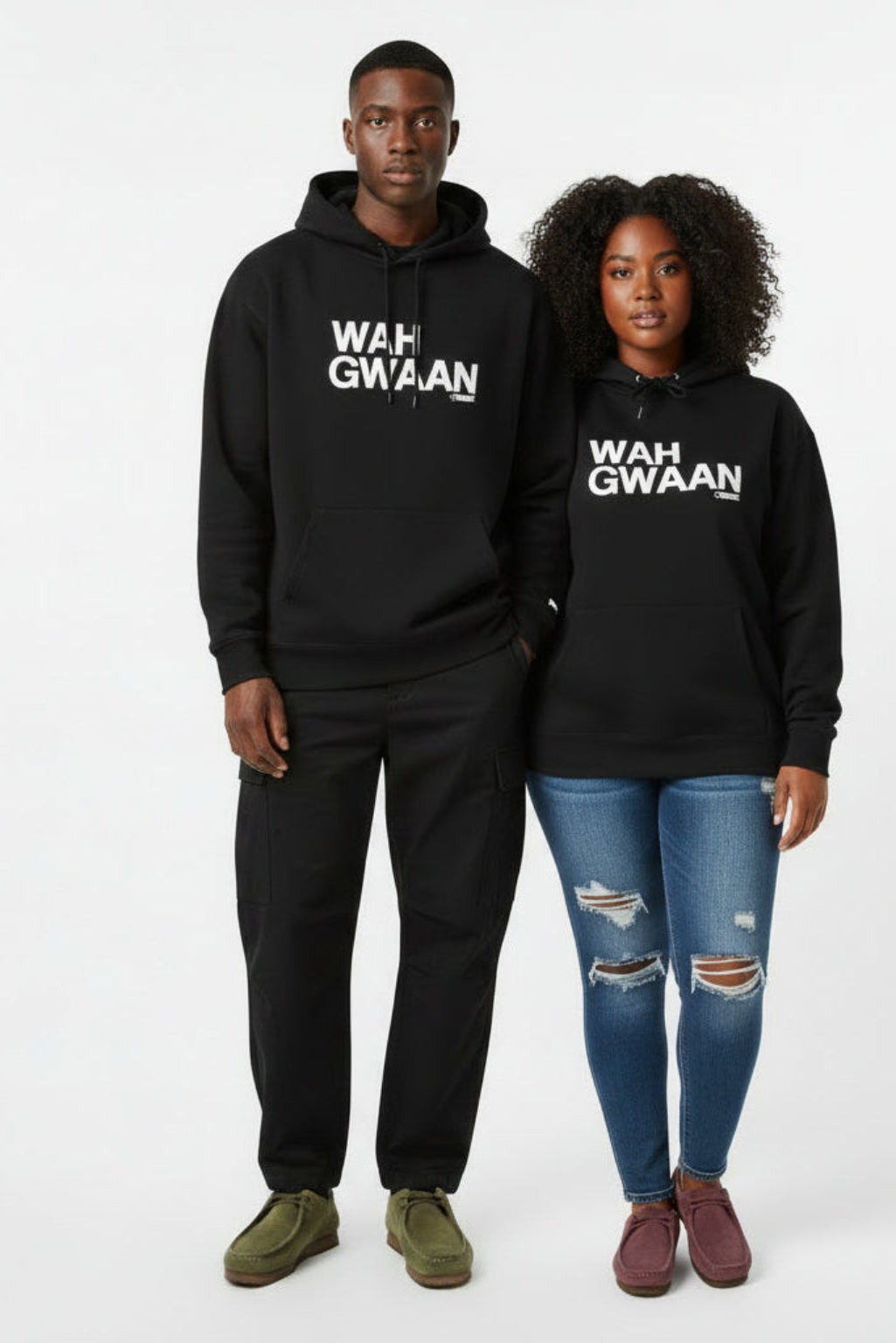 Man and Woman wearing black hoodies with 'WAH GWAAN' text on a white background